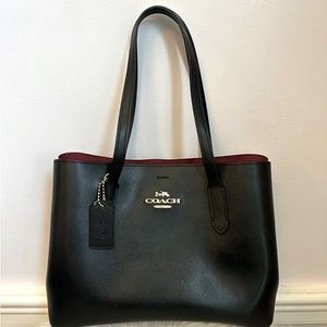Coach  large Avenue Carry all in black with red interior.